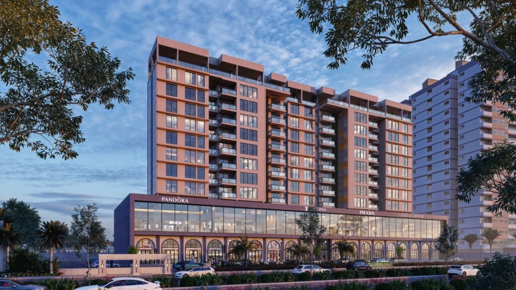 High-rise residential tower with luxury retail podium, commercial storefronts, landscaped frontage, and modern mixed-use architecture.