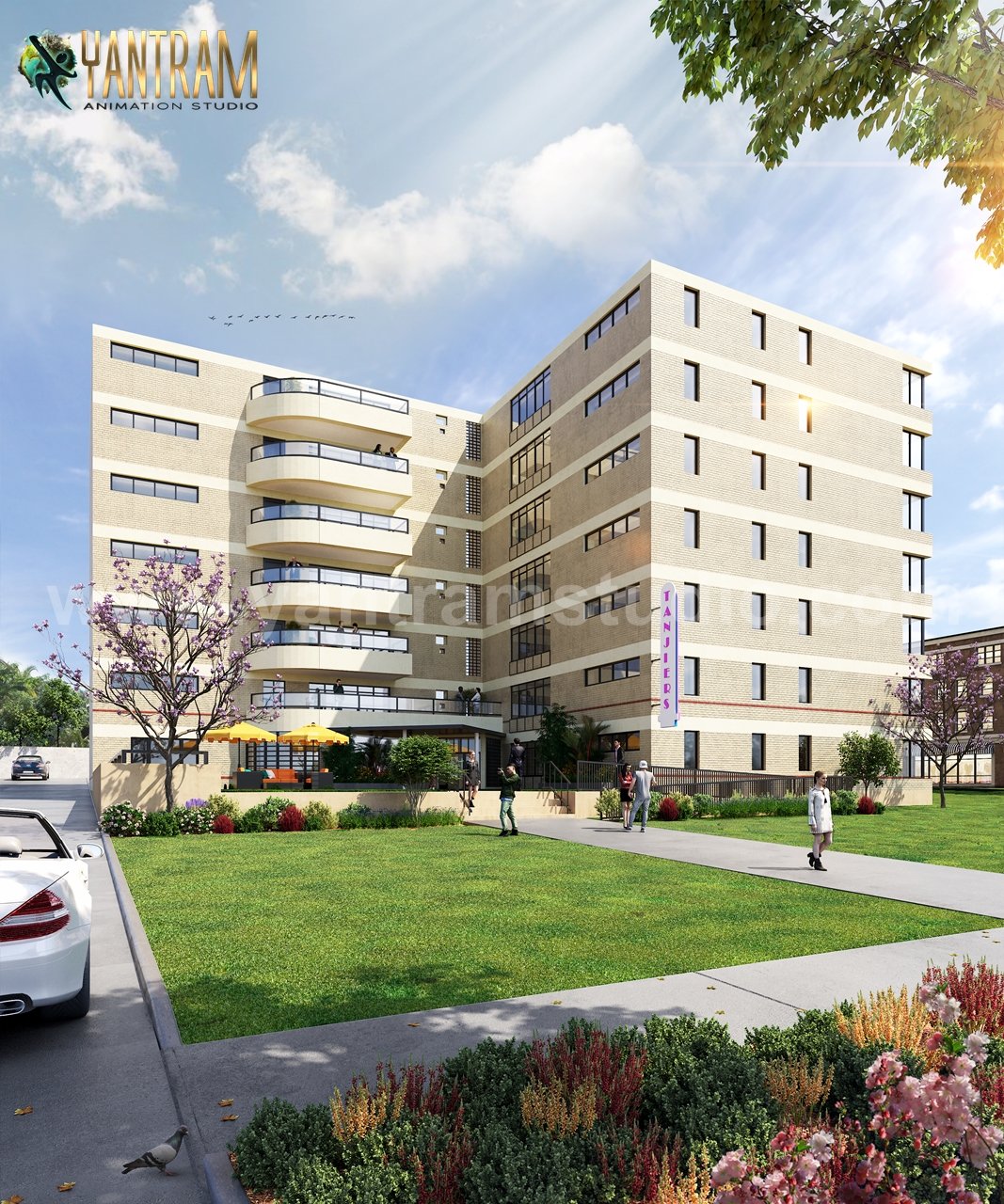 Modern mid-rise apartment building with curved balconies, brick façade, landscaped lawn, pedestrian pathways, and outdoor seating area.