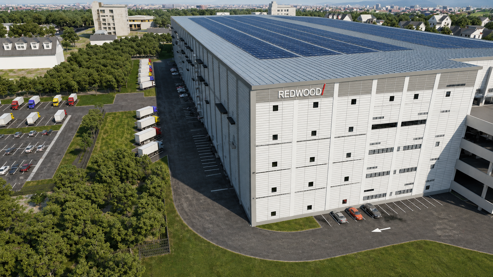 Aerial architectural visualization of a tall modern logistics warehouse with rooftop solar panels, vertical panel façade, truck loading areas along the side, staff parking spaces, and surrounding greenery.