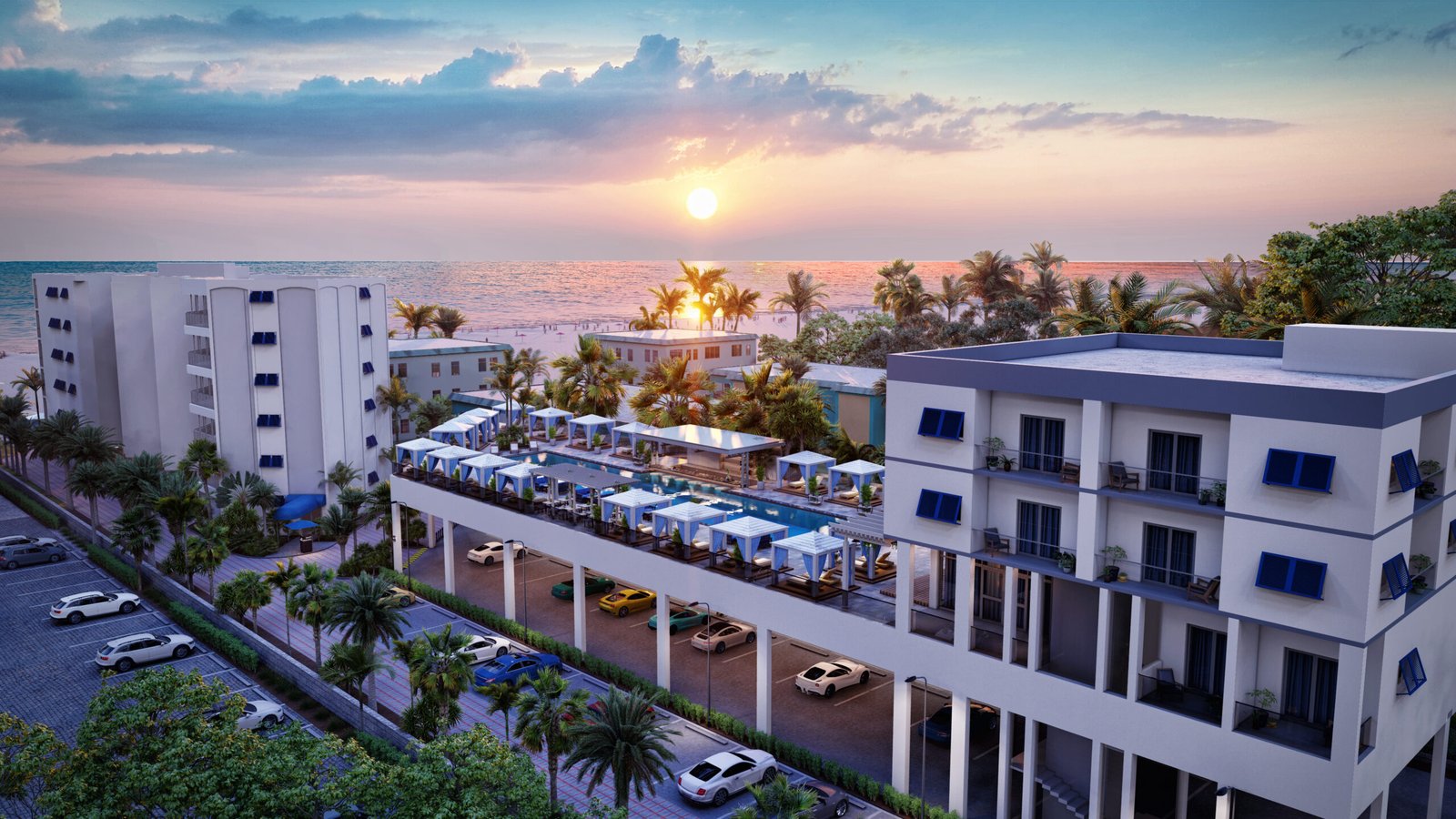 Beachfront or waterfront residential development at sunset with dusk sky, lit interiors and multiple building blocks