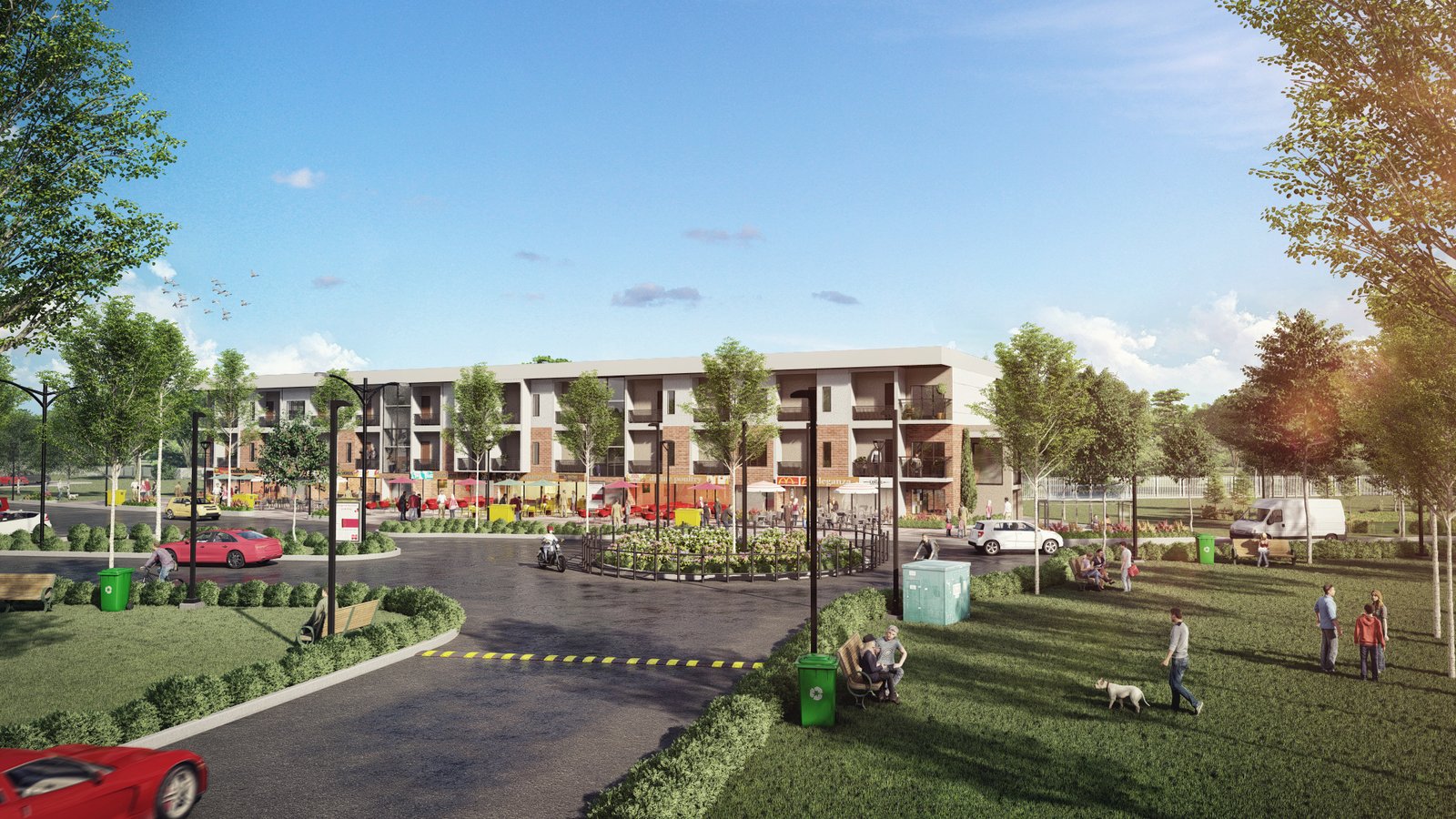 Modern three-story apartment buildings overlooking a landscaped parking area and green lawn with walking paths and residents outdoors on a sunny day. – 3D visualization  by Yantram Studio