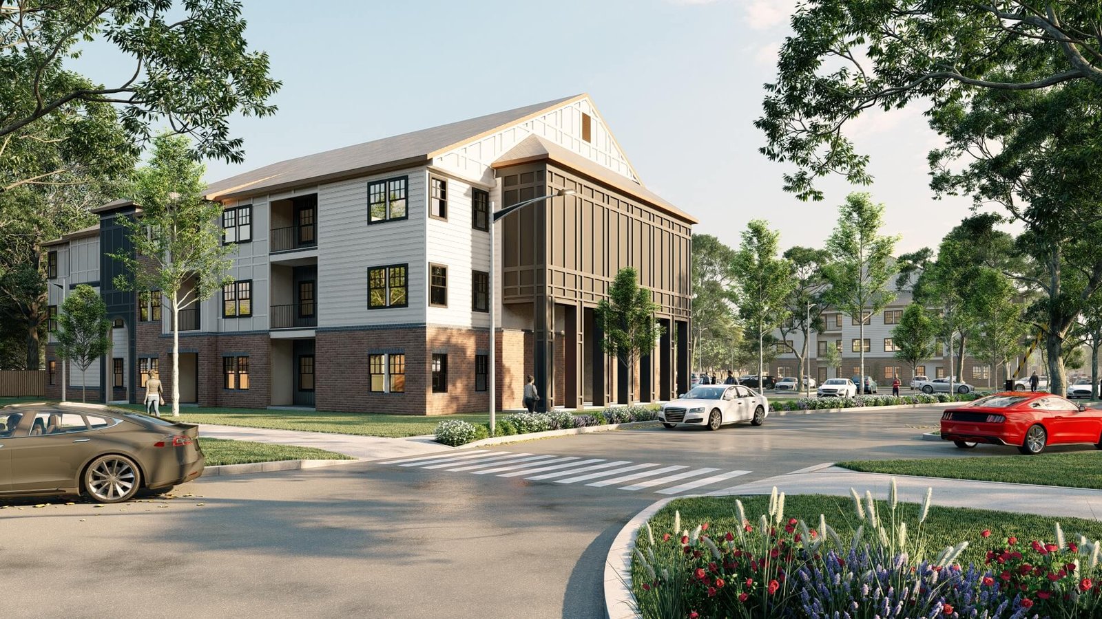 Modern three-story residential apartment building with brick and siding façade, corner balcony feature, landscaped street frontage, and cars at intersection.