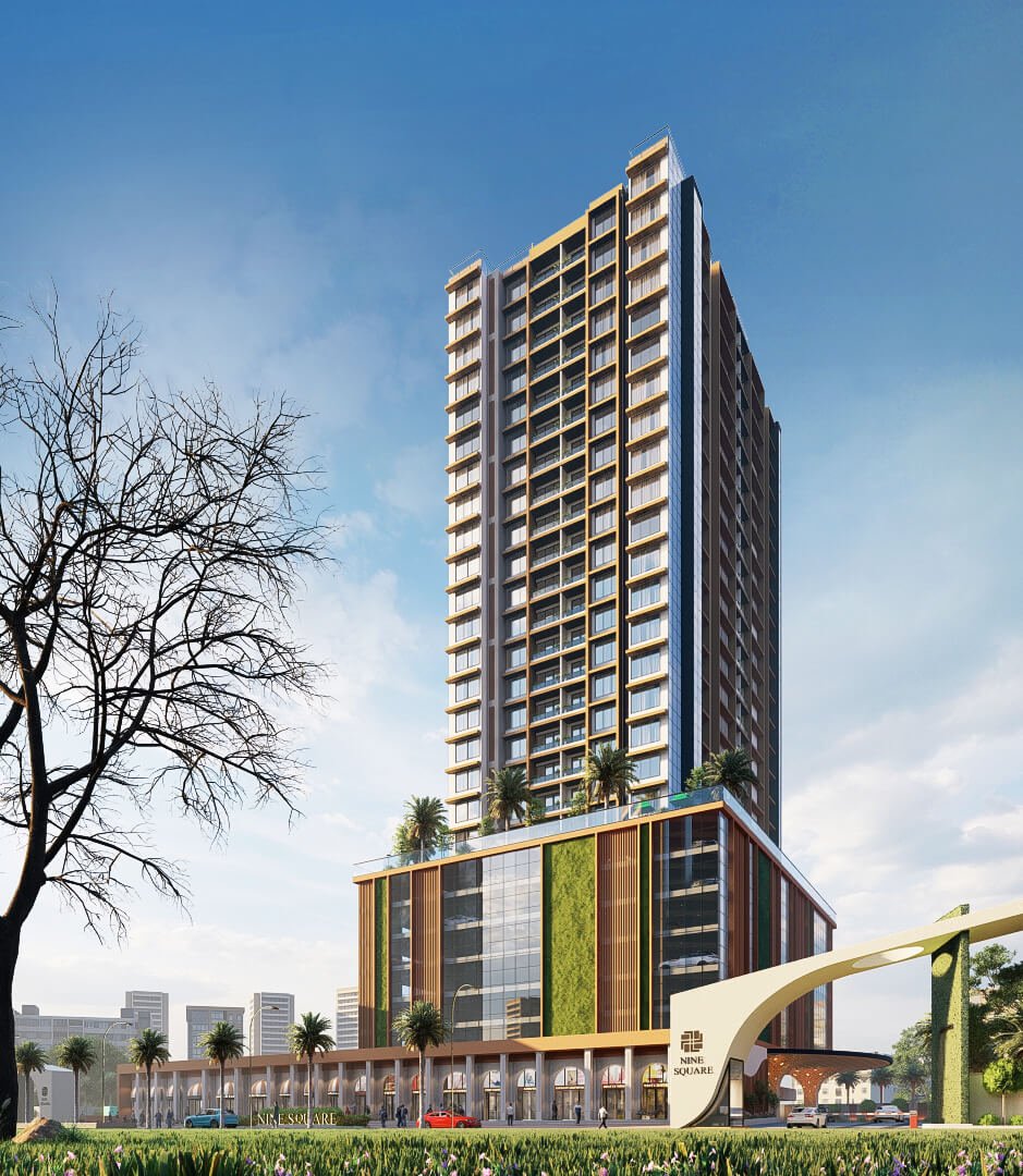 Modern high-rise tower with glass façade, landscaped podium, vertical green wall, retail colonnade, and sculptural entrance arch under clear blue sky.