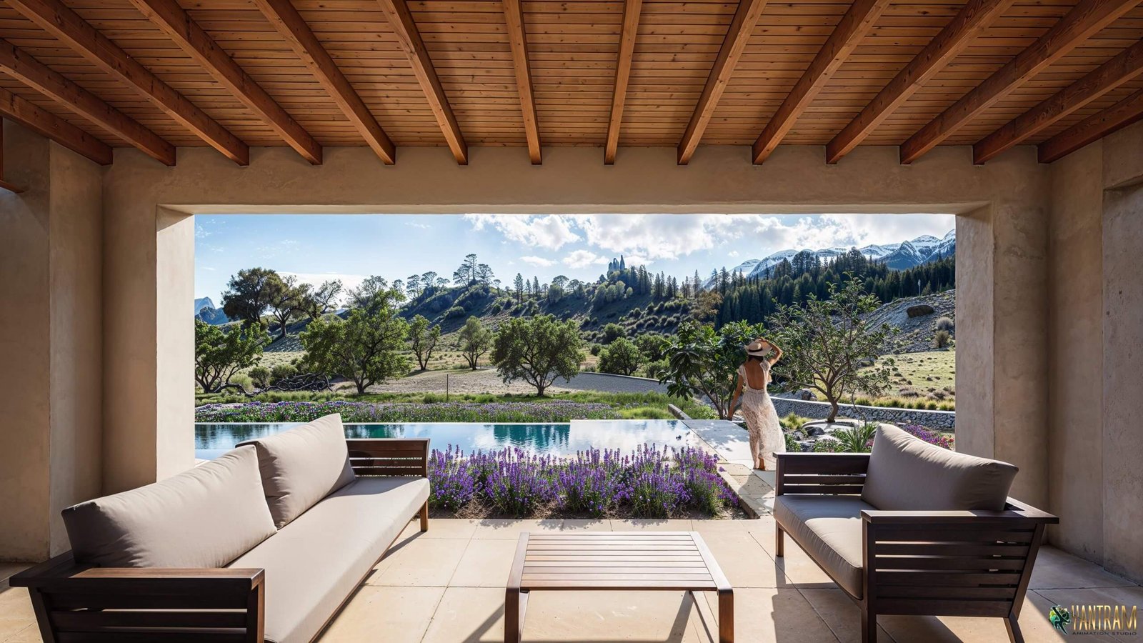 Modern covered patio with wooden ceiling beams, outdoor sofa seating, infinity pool, purple lavender landscaping, and panoramic mountain landscape view.