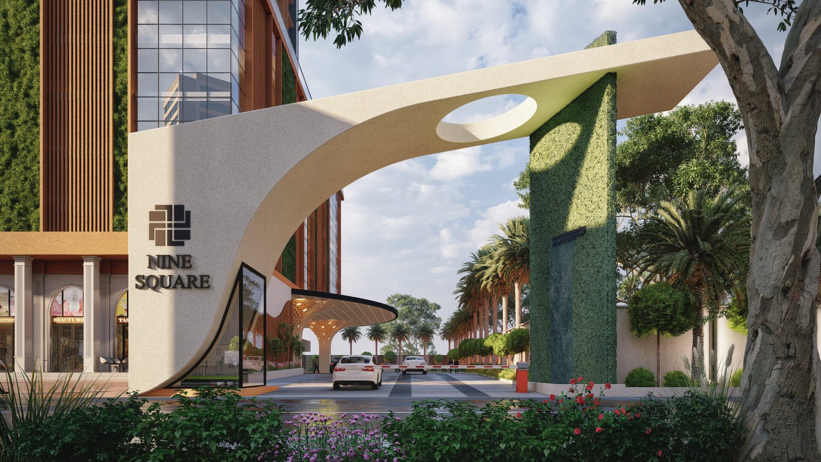 Contemporary Mixed-Use Development Entrance with Iconic Architectural Arch Modern commercial complex entrance featuring large sculptural archway, vertical green walls, palm trees, landscaped driveway, and urban mixed-use buildings.