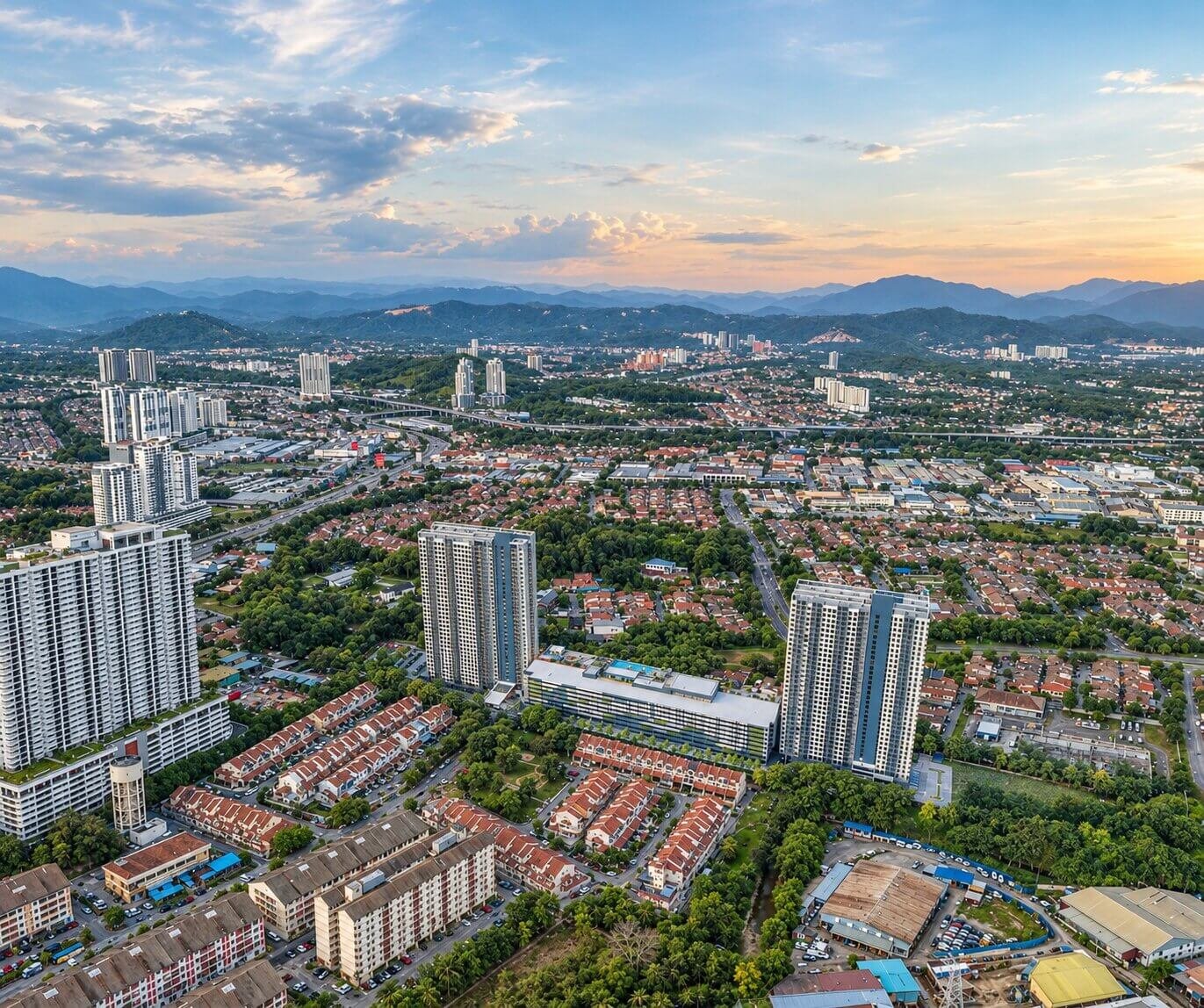 Wide cityscape aerial render showcasing twin high-rise residential towers set against Manchester city landscape