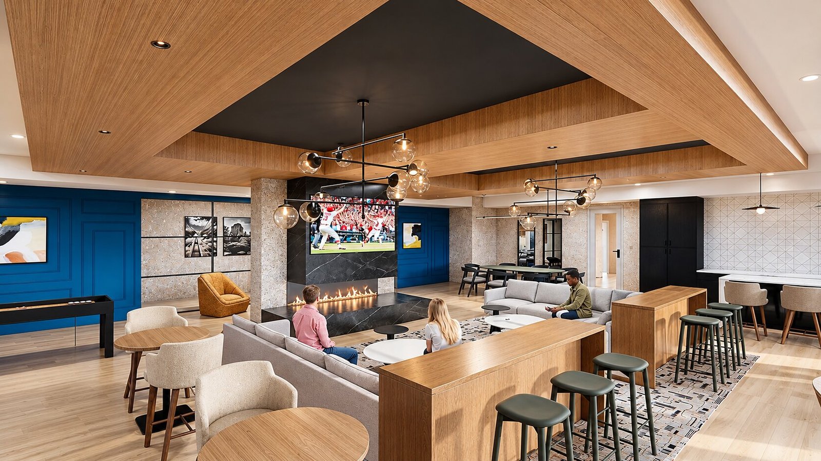 Modern Clubhouse Lounge with Bar Seating and Media Wall Contemporary clubhouse lounge interior with wooden ceiling panels, bar counter with stools, sectional seating, wall-mounted television, and fireplace feature wall.