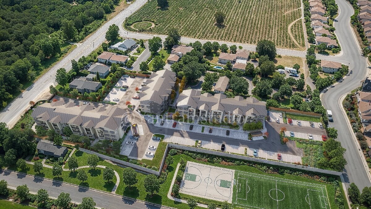 Aerial 3D rendering of a residential housing masterplan with internal roads, landscaped areas, parking, and sports courts – 3D rendering by Yantram Studio